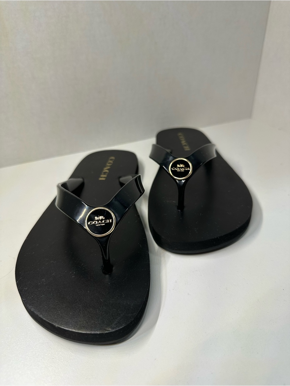 Coach Black Jelly Flip Flops Gold Logo Medallion Thong Sandals | Women’s 7B
